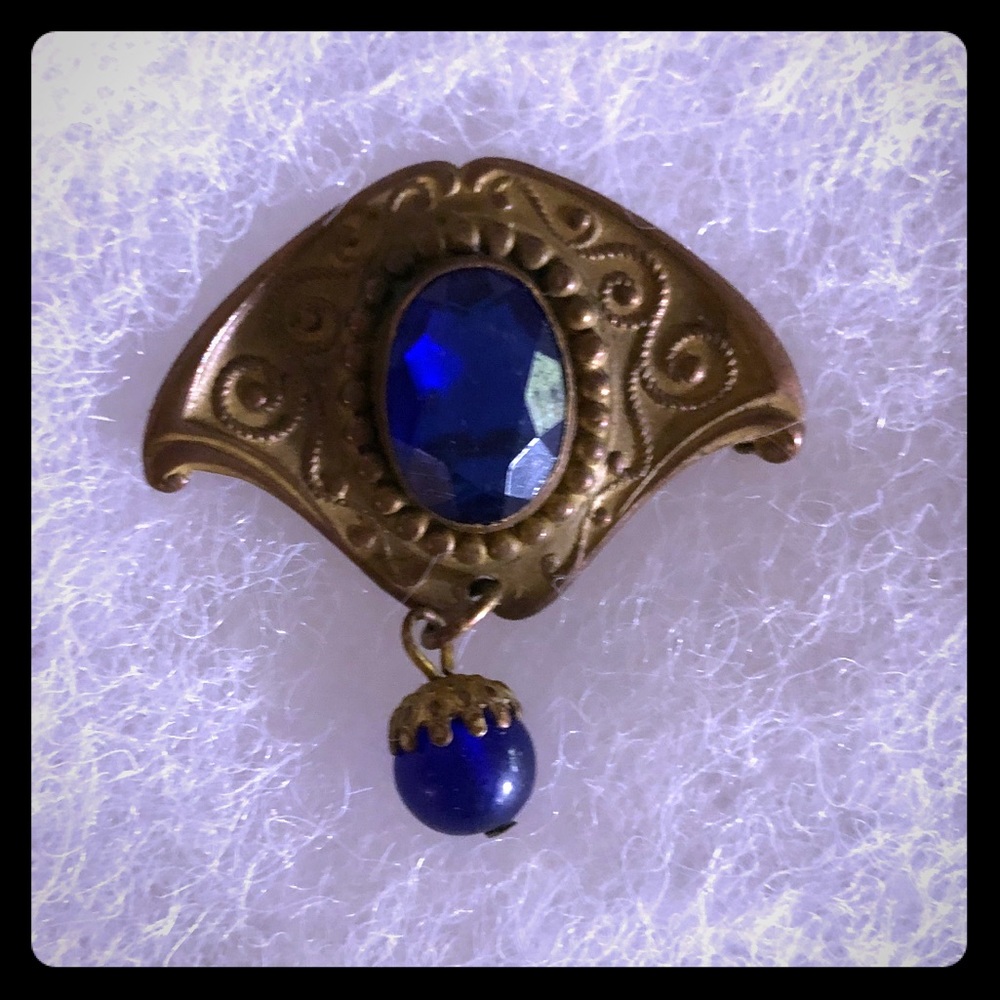 Old fashioned blue stone brooch